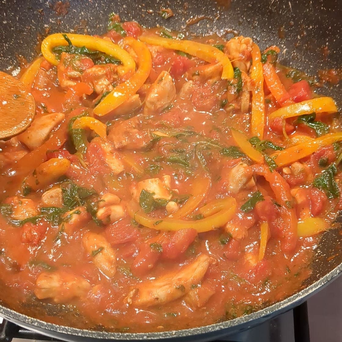 Tomato Chicken with spinach and bell peppers