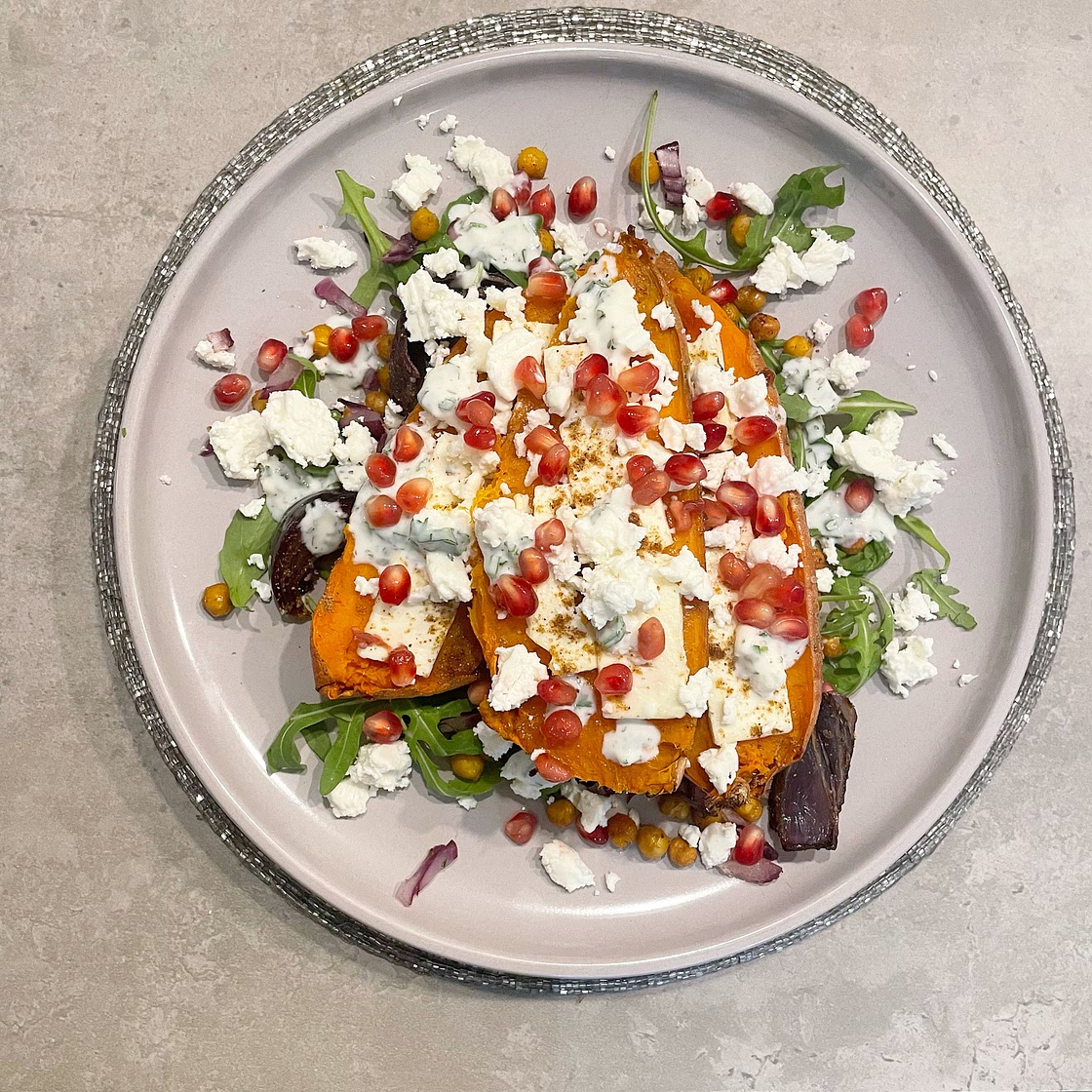 Delicious slow-roasted sweet potato with feta and pomegranate