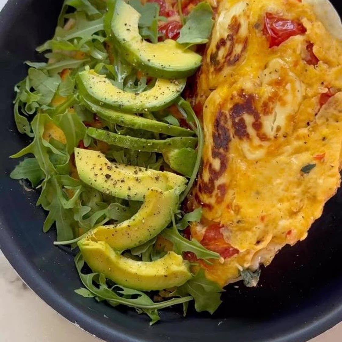 CHERRY TOMATO, HALLOUMI, AVOCADO EGG FLIP