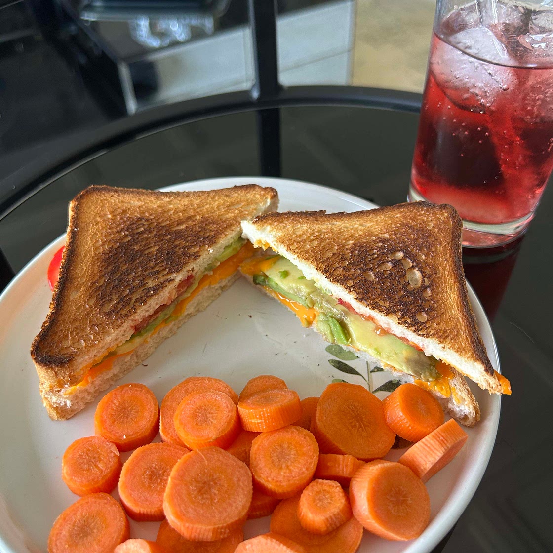 Avocado cheddar cheese and tomato sandwich
