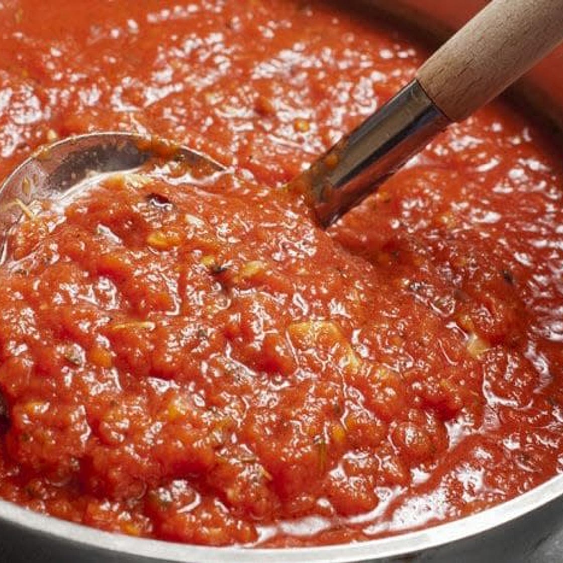 Nanny's famous authentic Italian gravy, spaghetti sausage and meatballs.