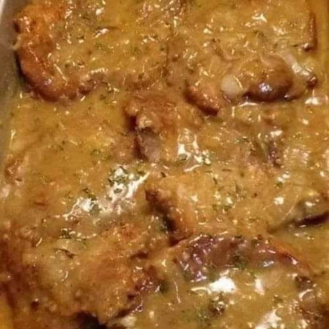 Pork chops with onion and mushroom gravy