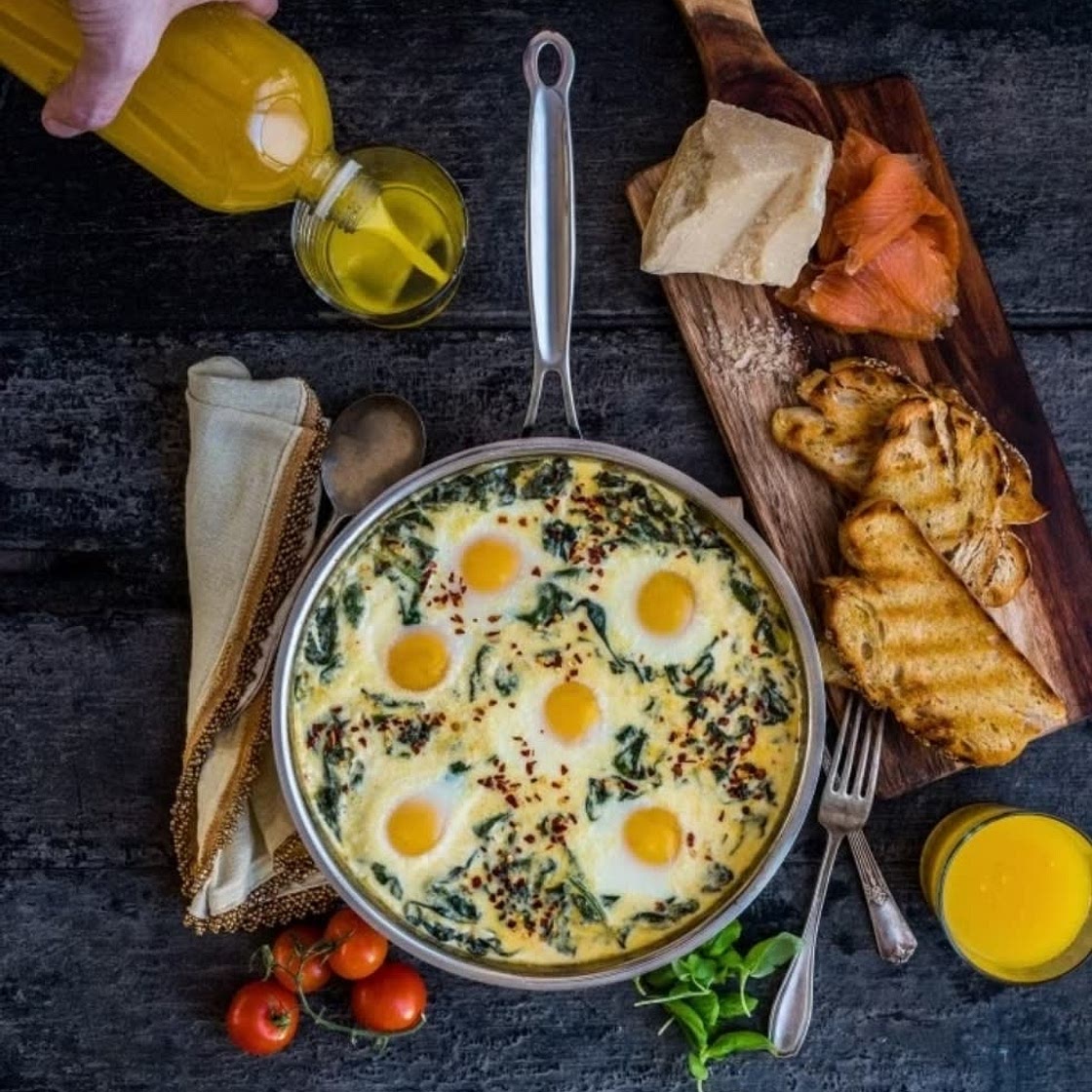 Baked Eggs in Ricotta Parmesan Creamed Spinach