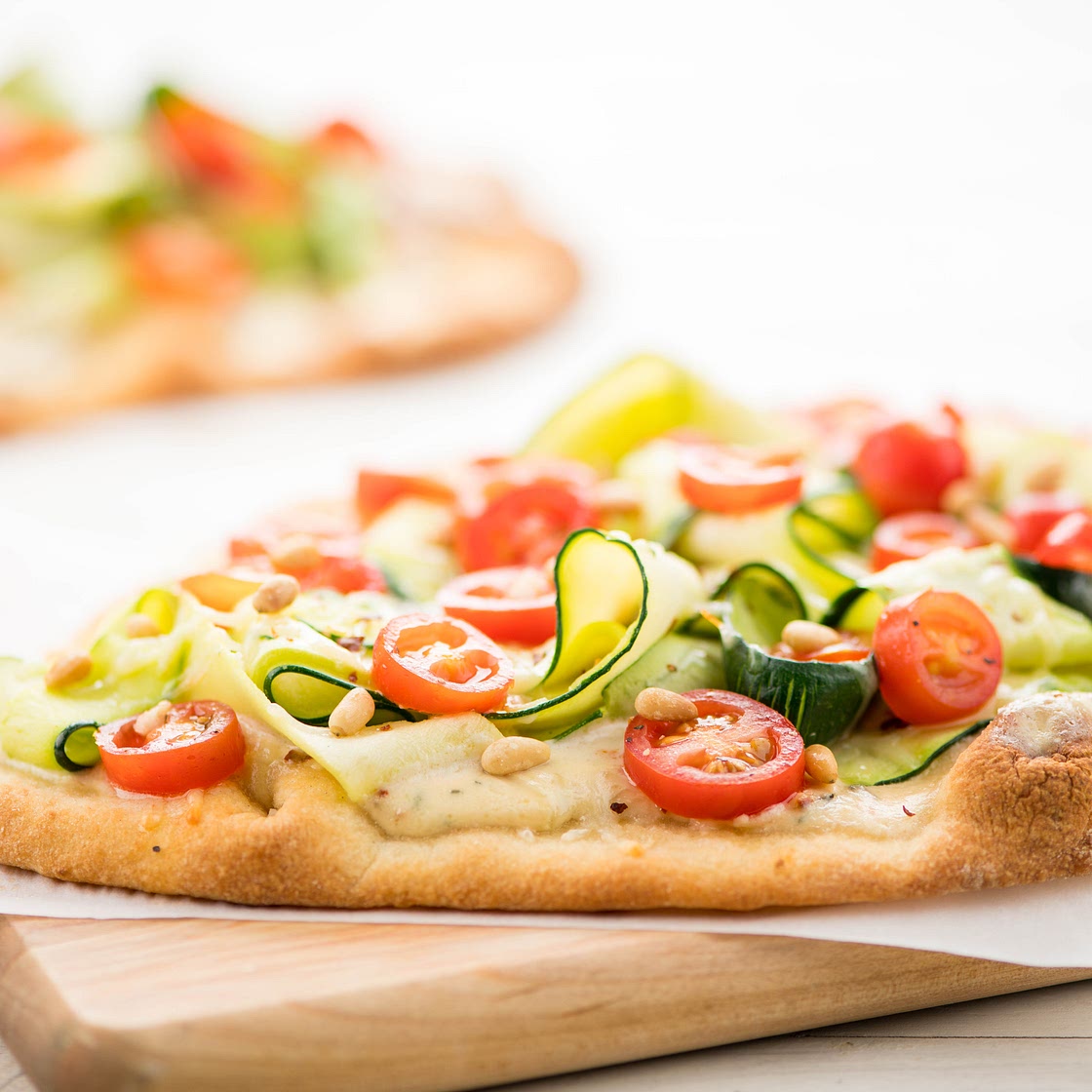 Pizza Bianca with zucchini ribbons and rosemary