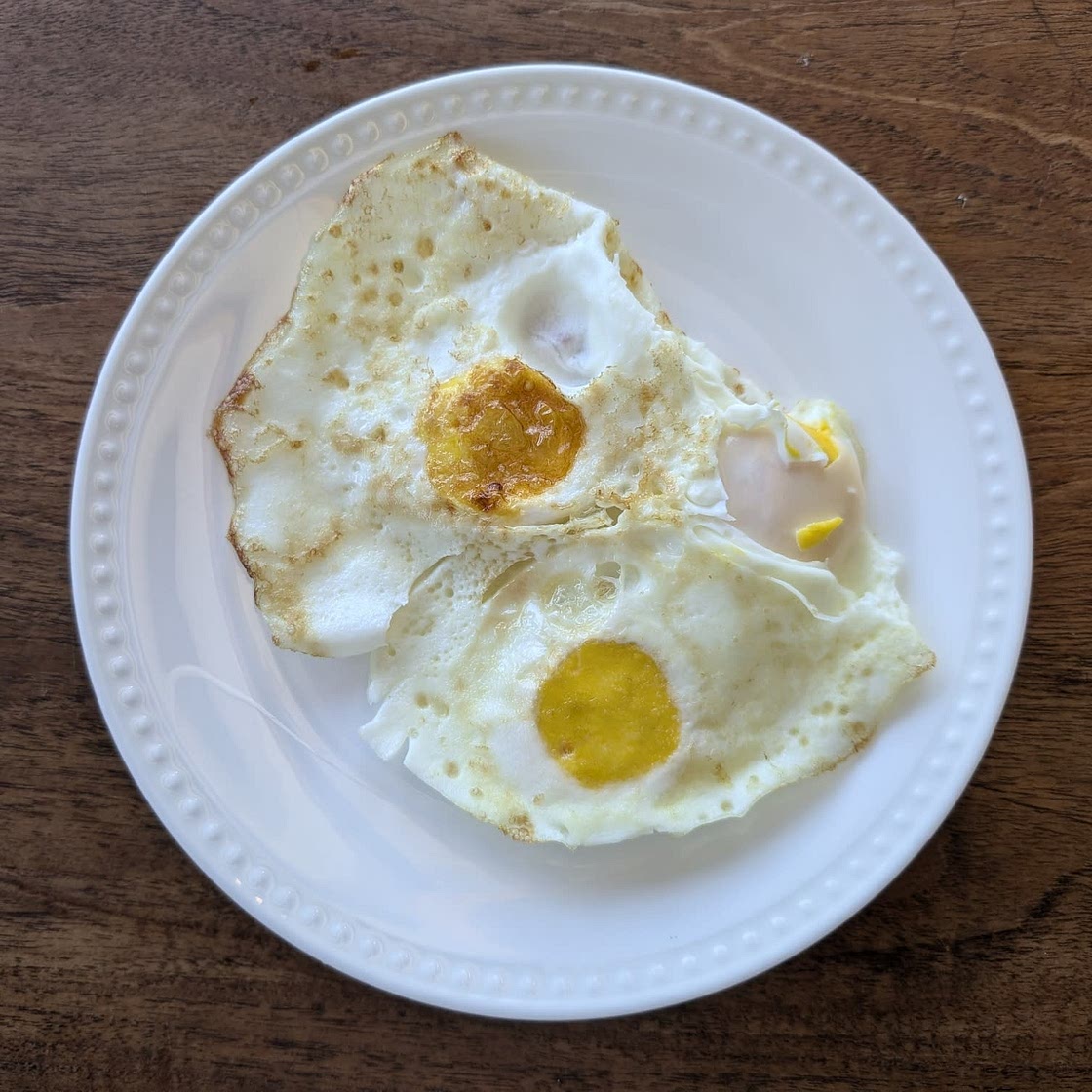 Mixed unsalted nuts and chia seeds with oranges, green grapes, green and red apples, strawberries, and Greek yogurt