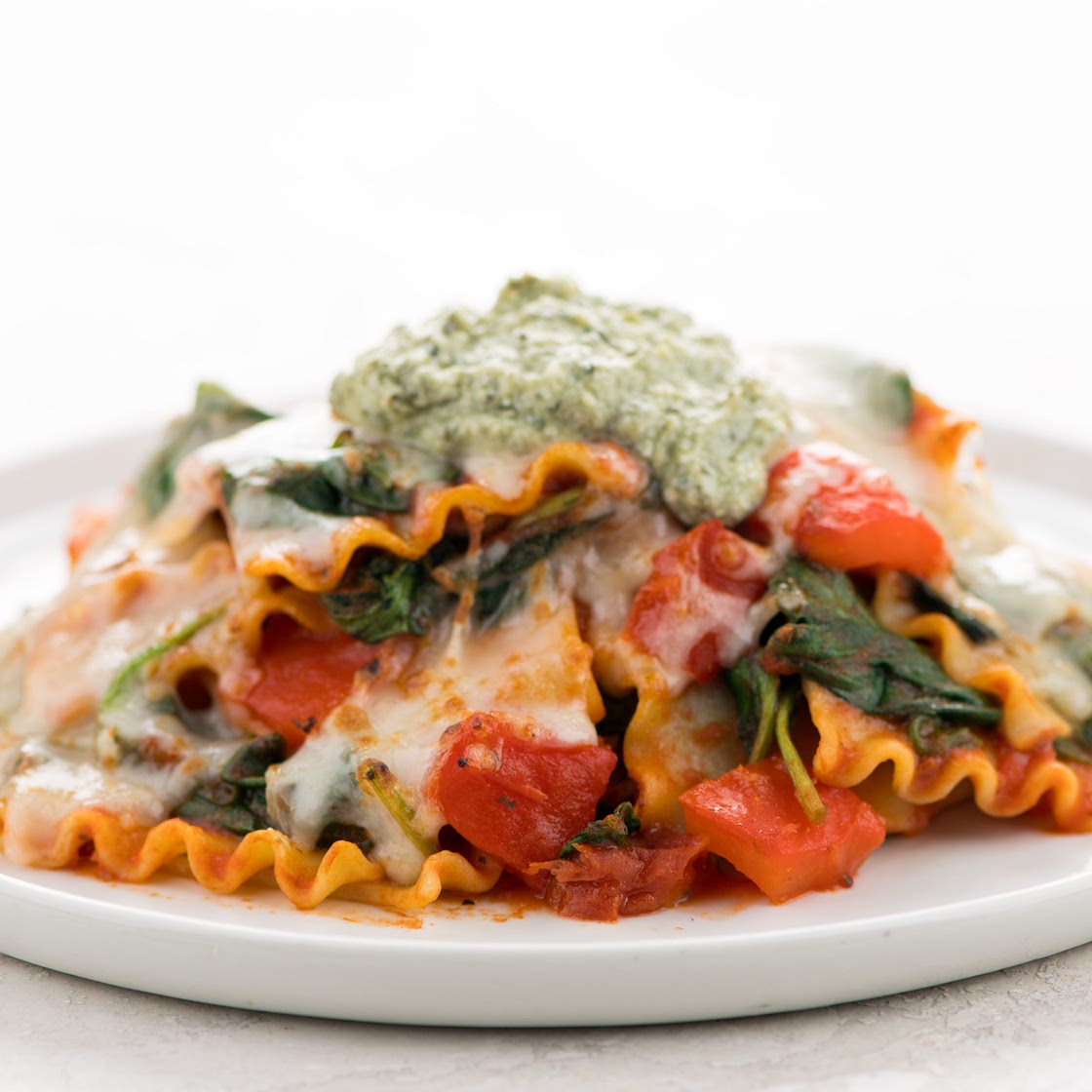 Cheesy Roasted Red Pepper Lasagna Skillet with pesto ricotta and spinach