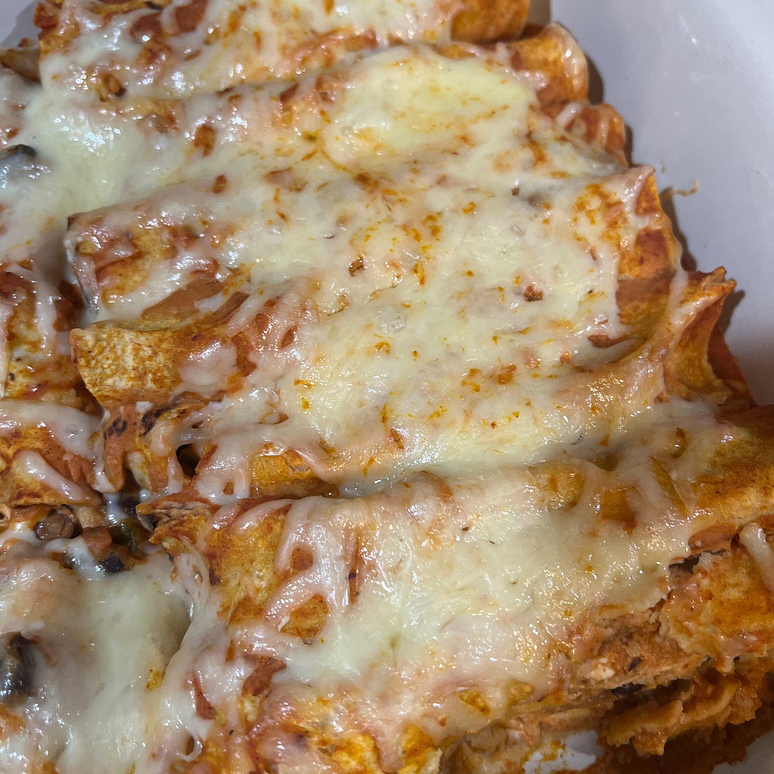 Spicy Black Bean Chicken Enchiladas with Pumpkin Sour Cream Sauce