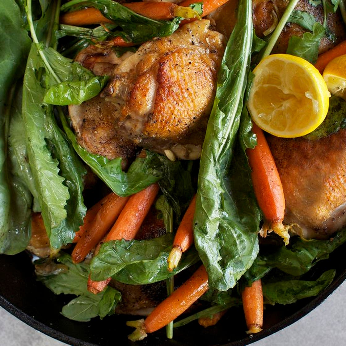 Skillet-Roasted Chicken Thighs With Dandelion Greens & Baby Carrots