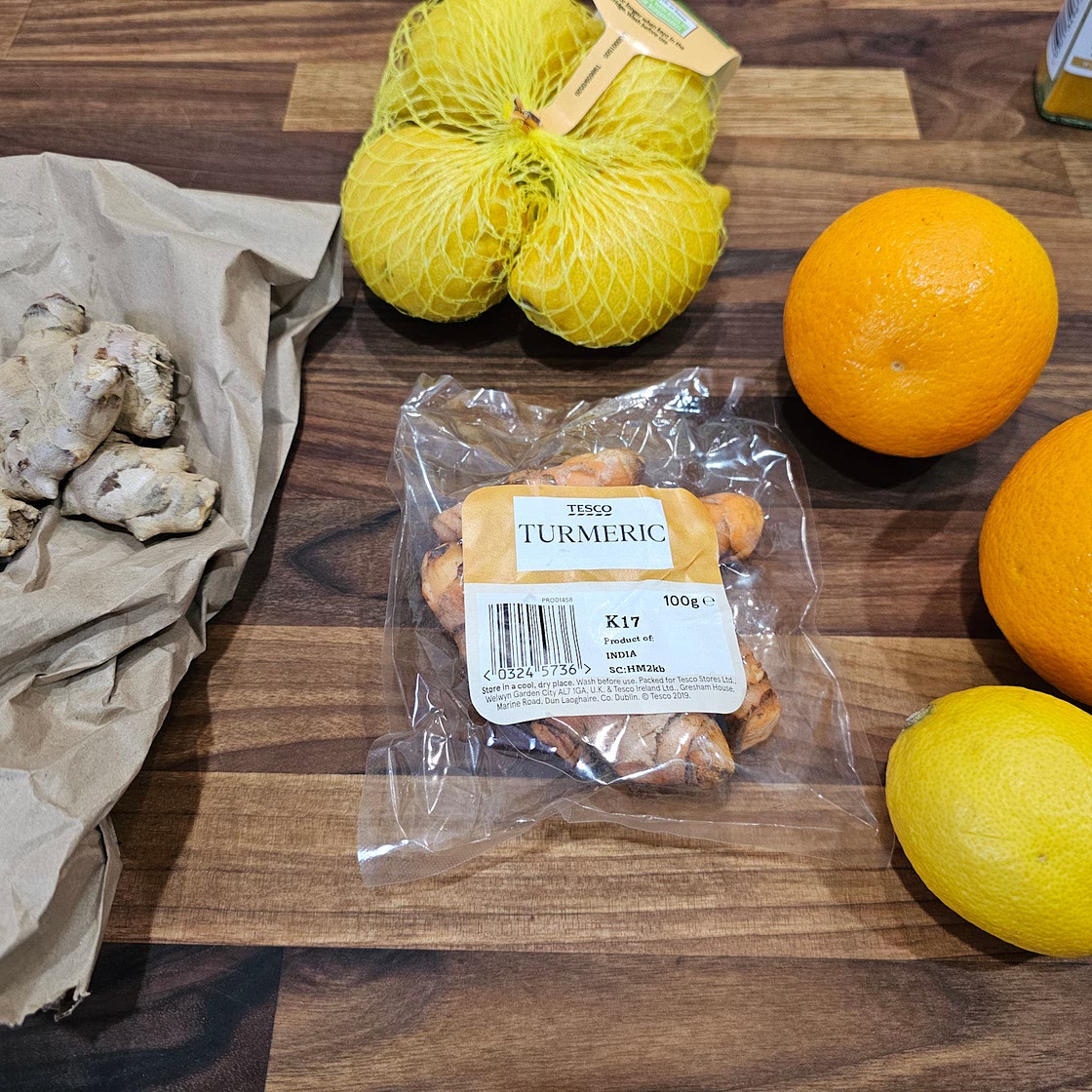 Health shot (ginger, turmeric, lemon, orange,. pepper)