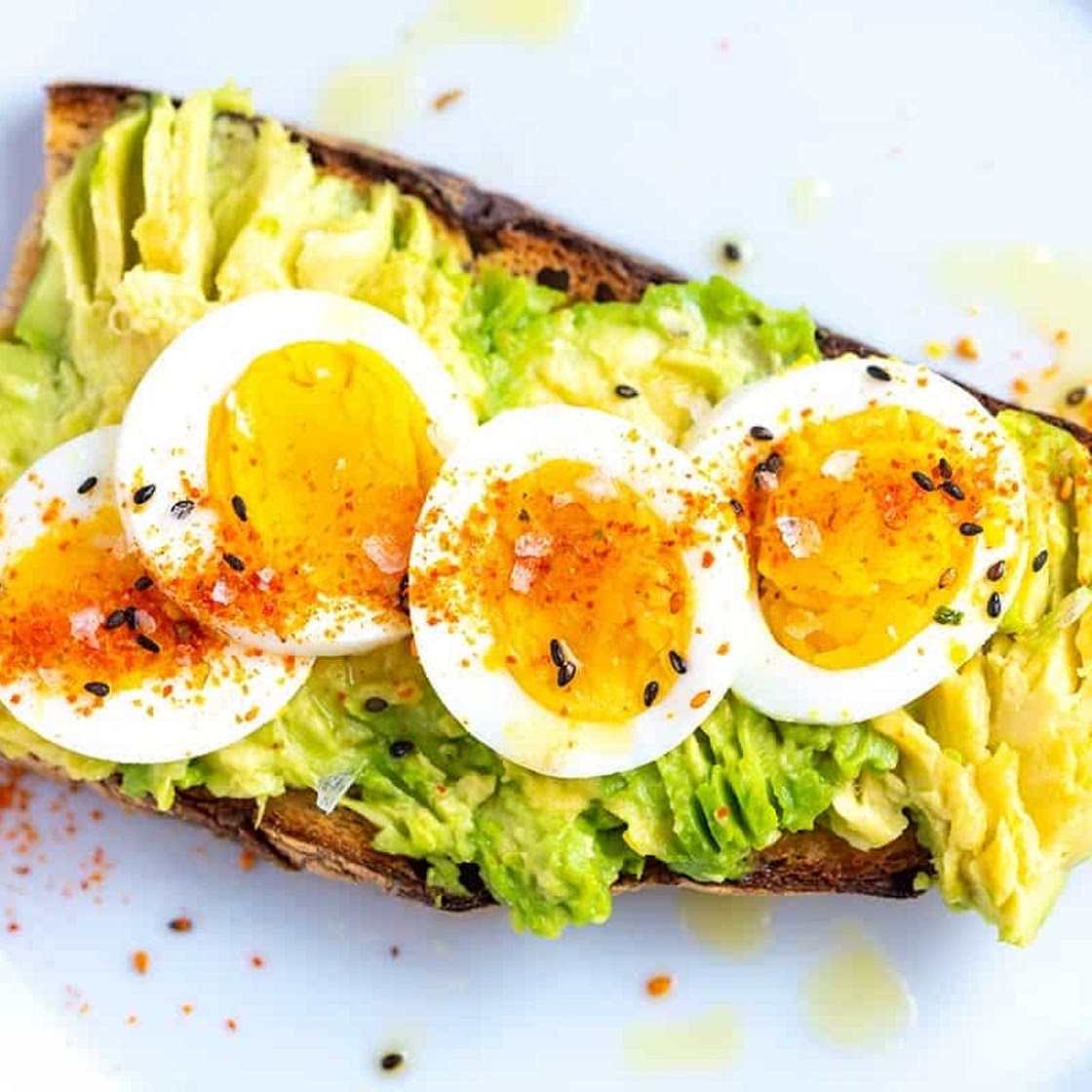 Avocado toast with hard boiled egg and red pepper flakes