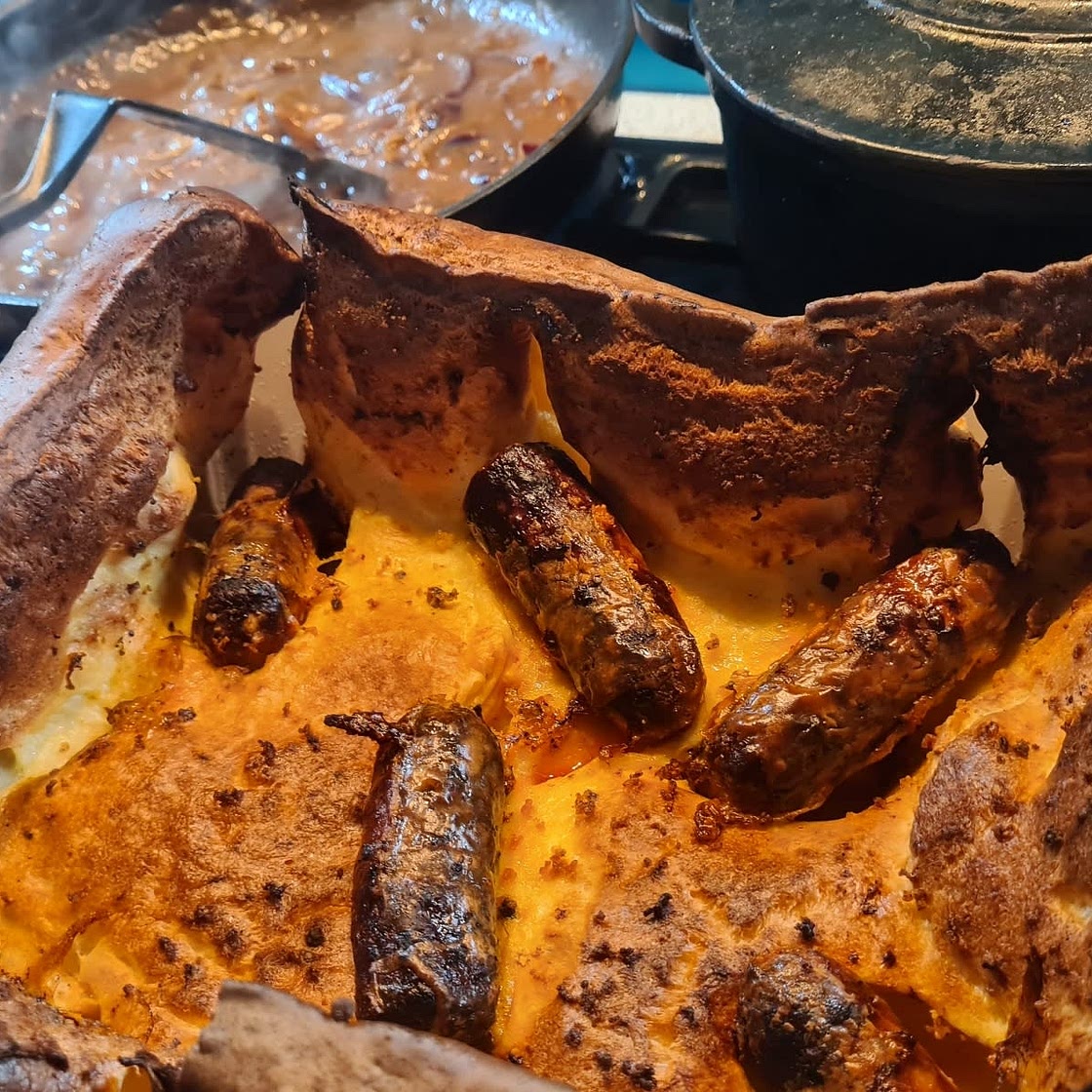 Toad in the hole with red onion gravy