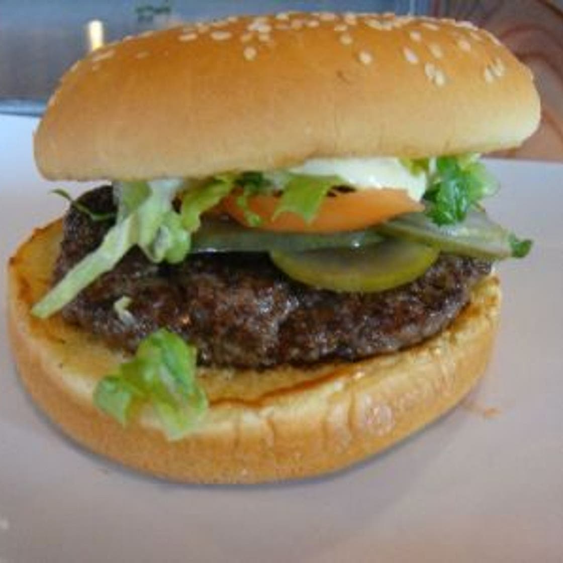 beef burger with tomato salad