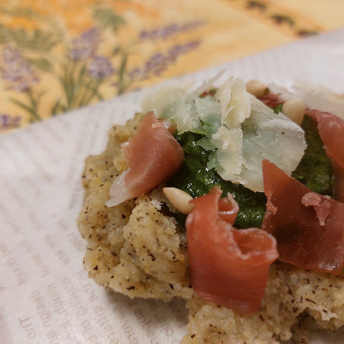 Polenta -  Prosciutto Crudo, rucola, and pine nuts