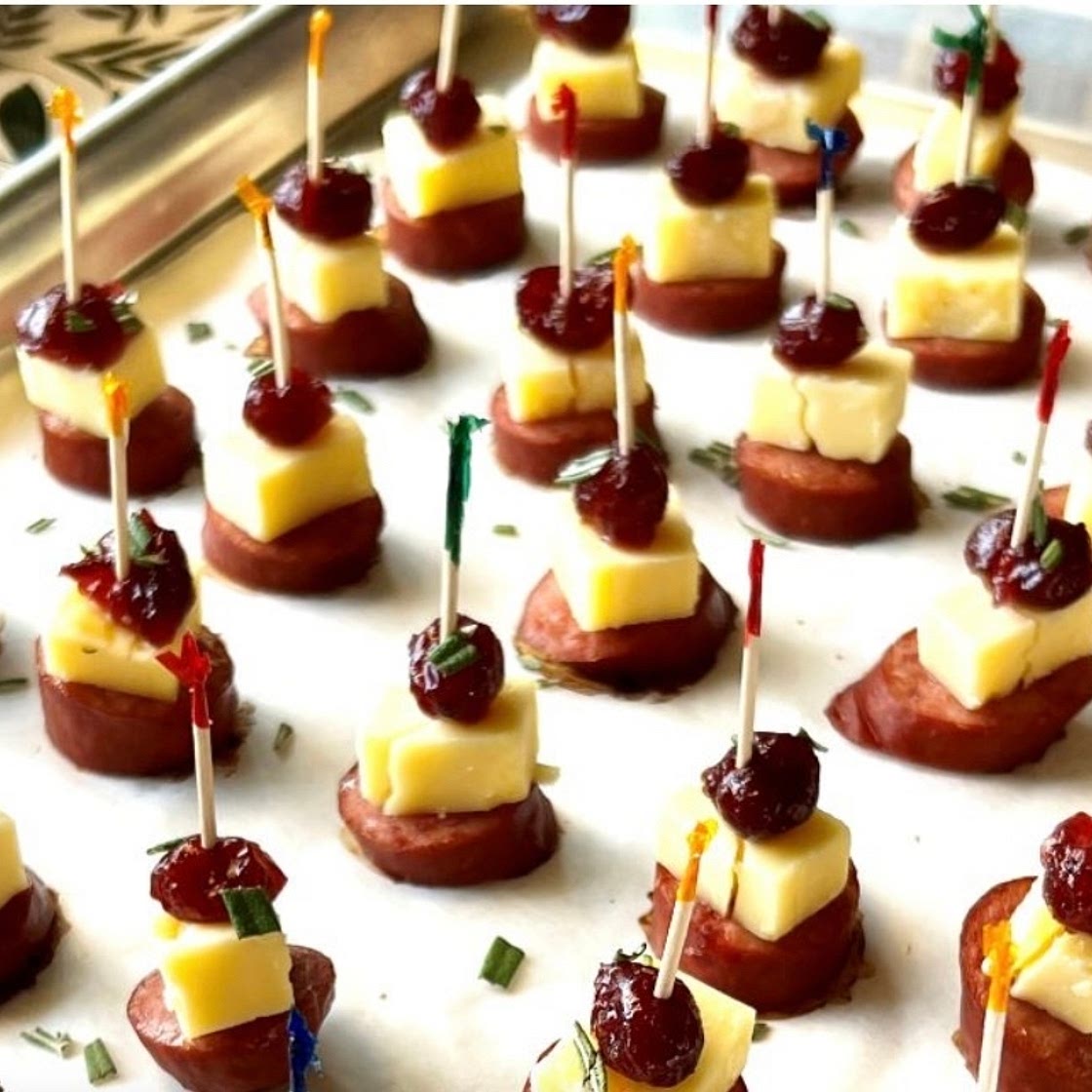 https://themenumaid.com/smoked-sausage-cranberry-cheddar-bites/