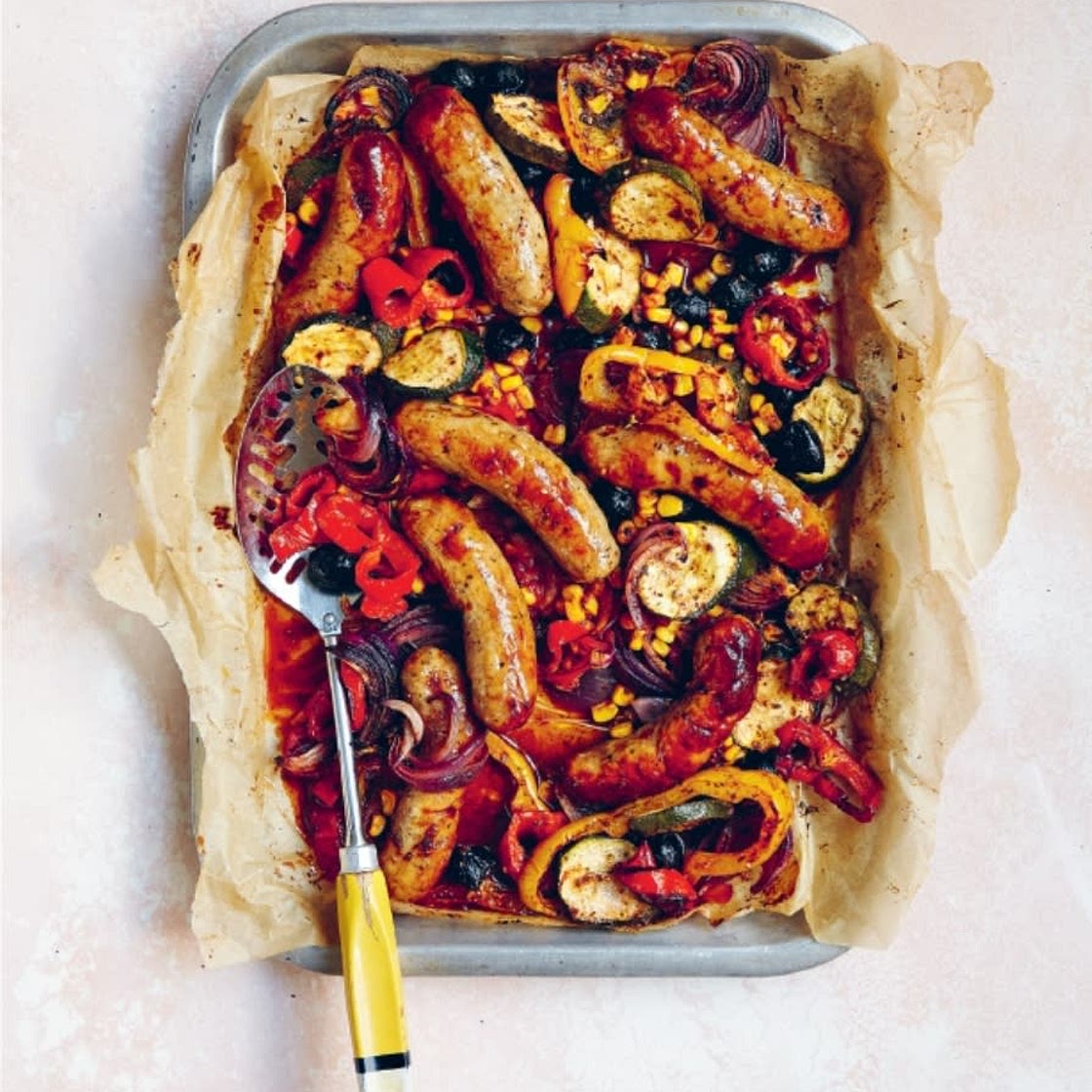 Sausages with sweetcorn, peppers and courgettes