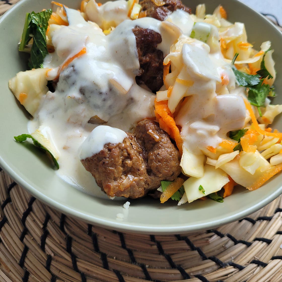 Lamb meatballs with cous cous and cabbage salad