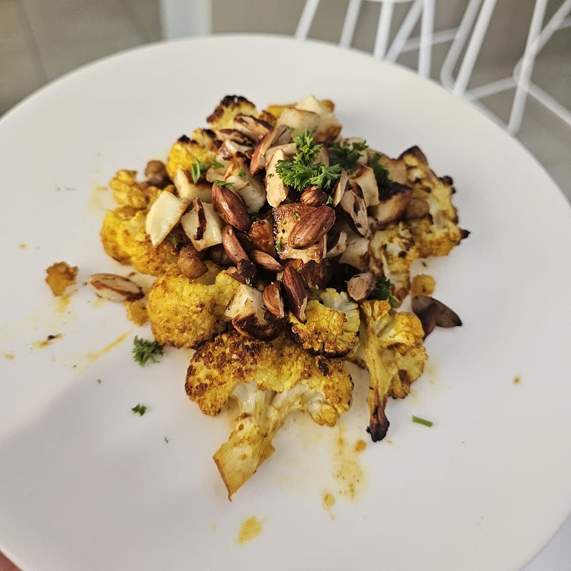 Honey curry roasted cauliflower with grilled haloumi and crunchy chickpeas