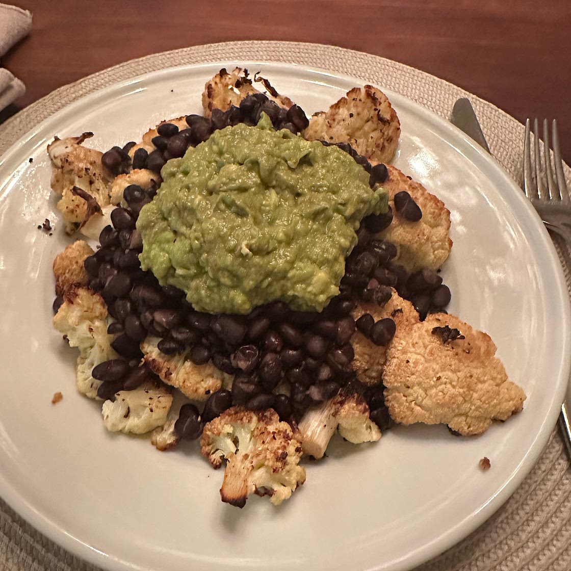 Cauliflower steak with black beans and diced tomatoes
