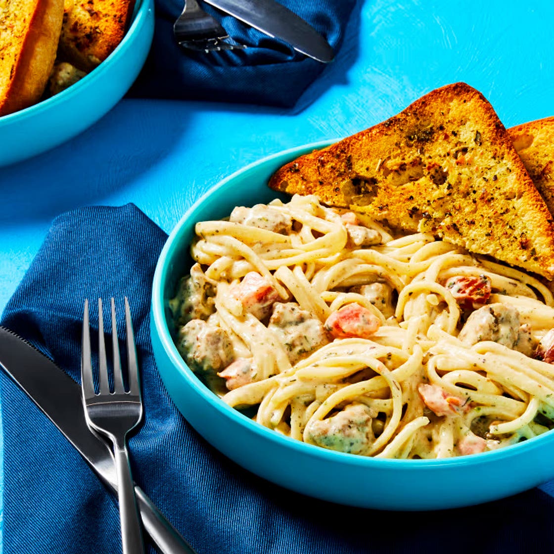 Creamy Tomato & Pork Sausage Linguine with Garlic Bread