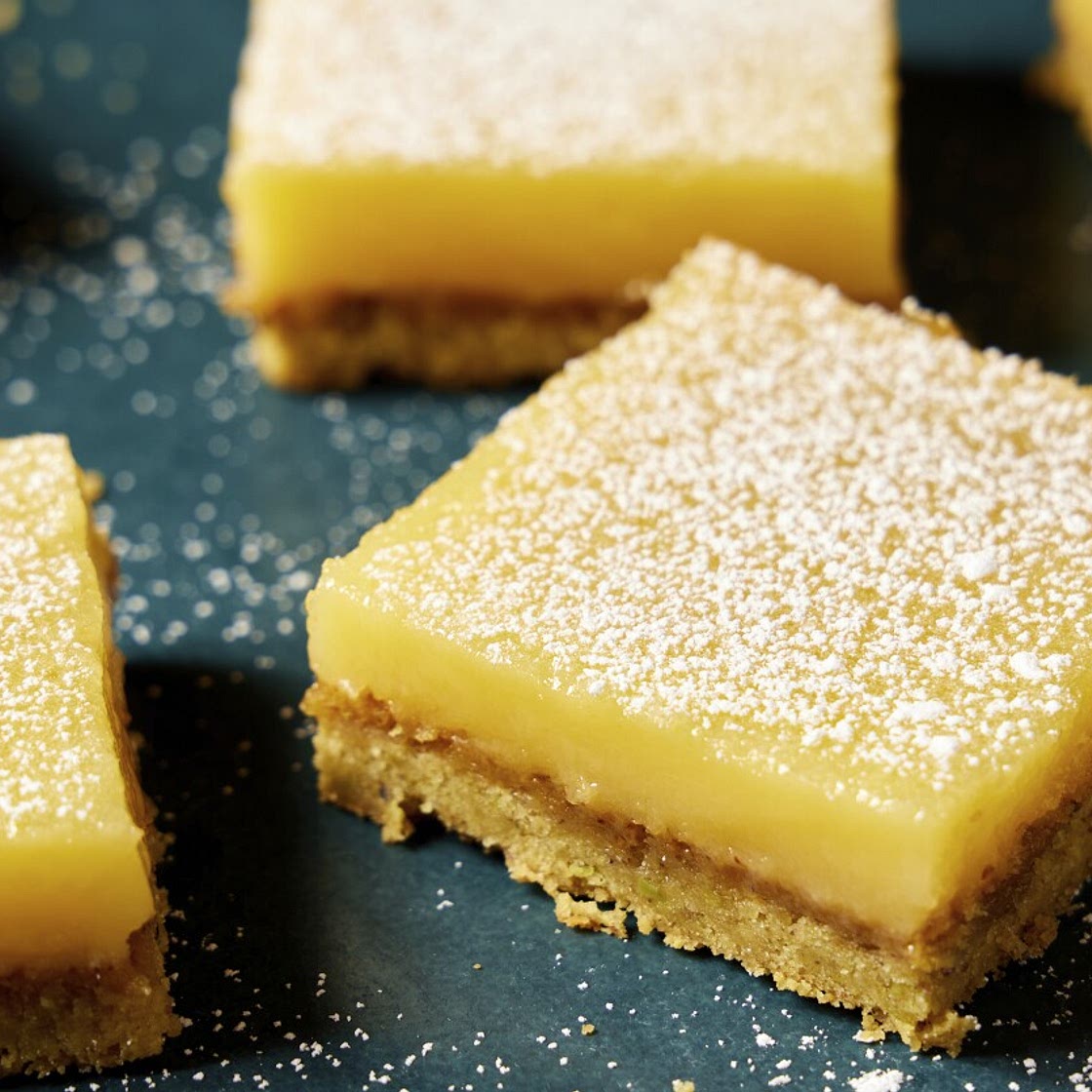 Savory olive oil and buttery pistachios bring sophisticated flavors to tangy-sweet lemon bars