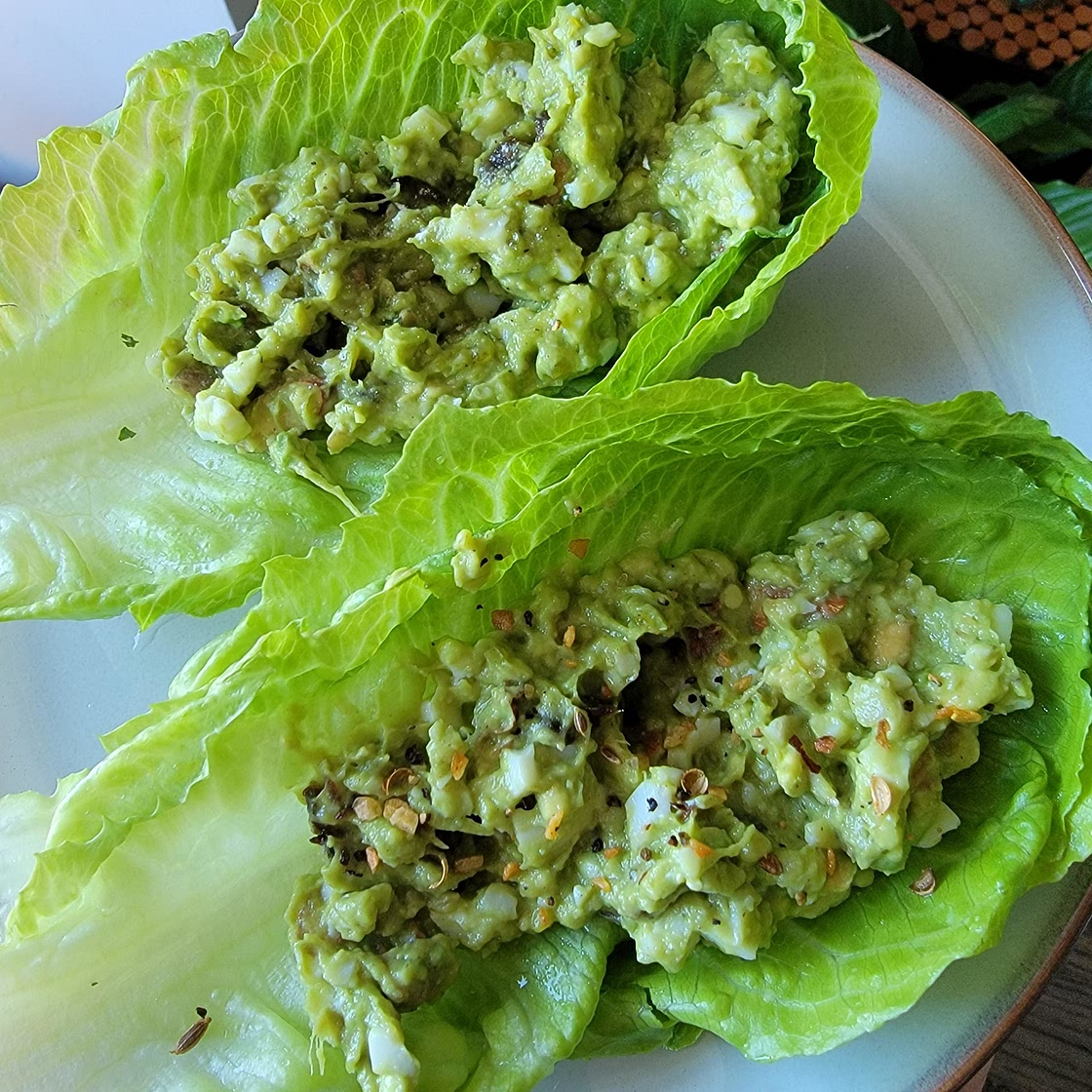 Romaine lettuce boats filled with guacamole - The Plant Paradox