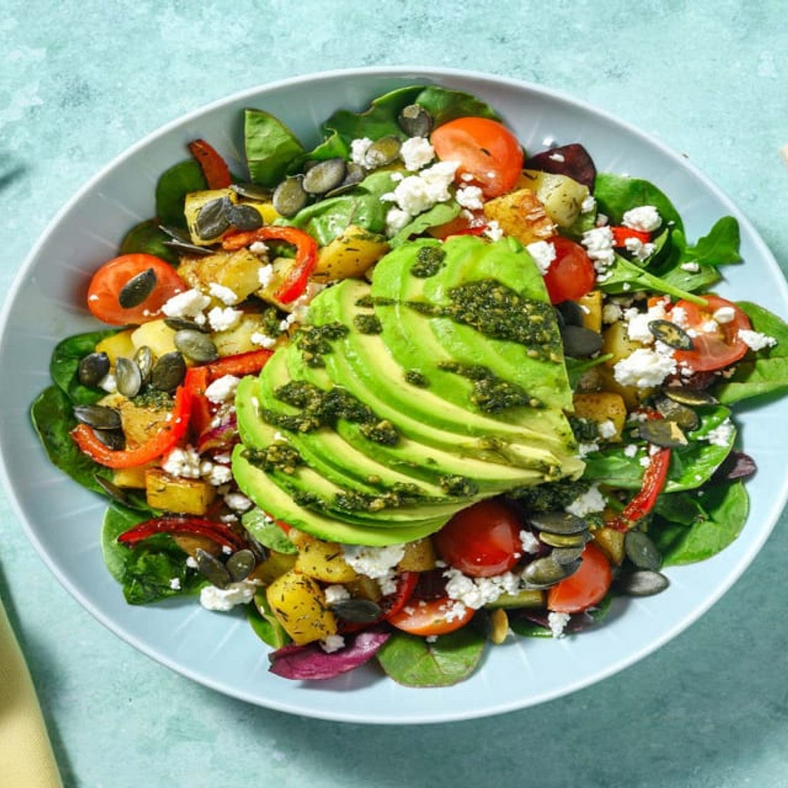Mediterranean Style Avocado & Roasted Pepper Salad with Greek Style Cheese, Herby Potatoes and Pesto Drizzle