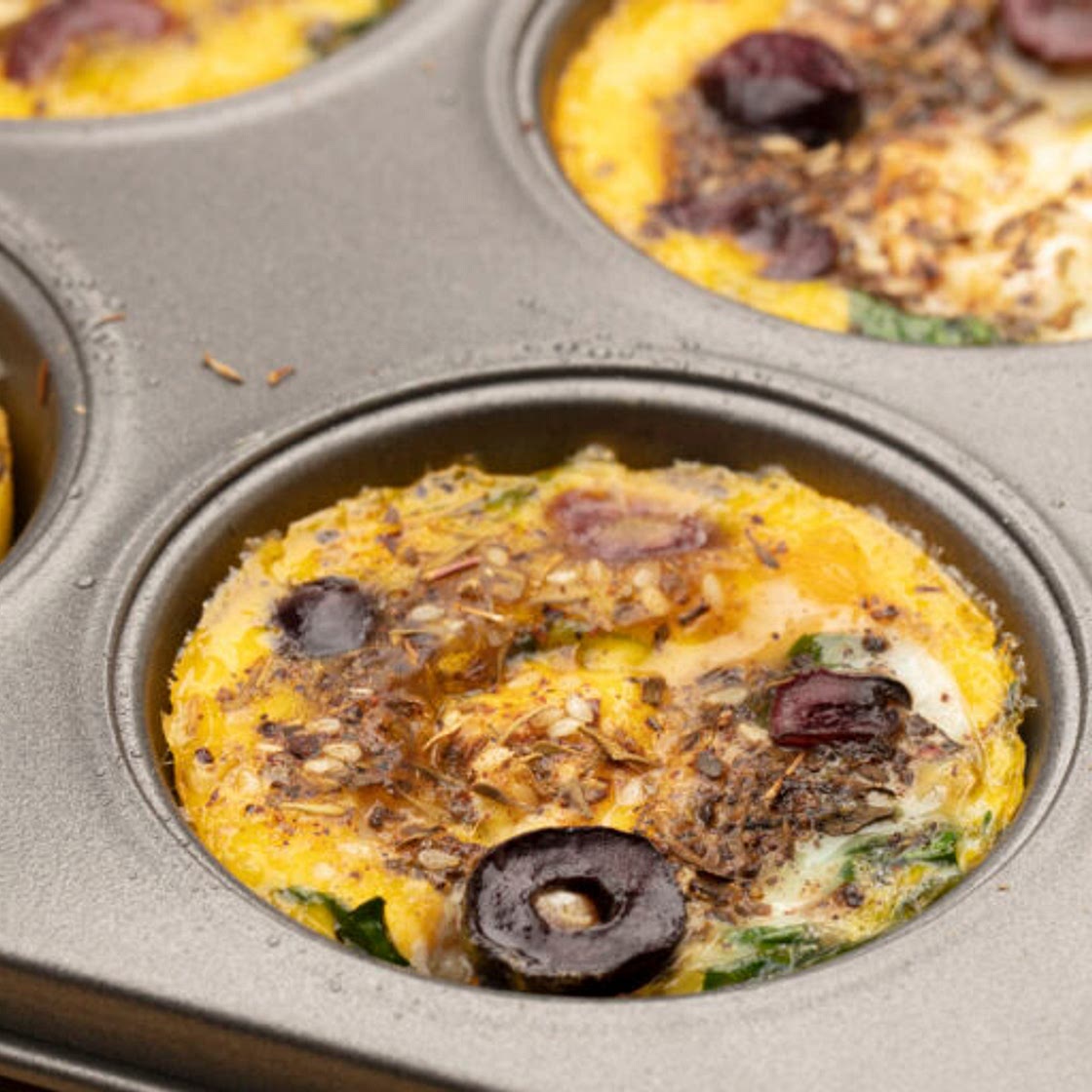 Za'atar Spiced Baked Eggs With Black Olives and Labneh