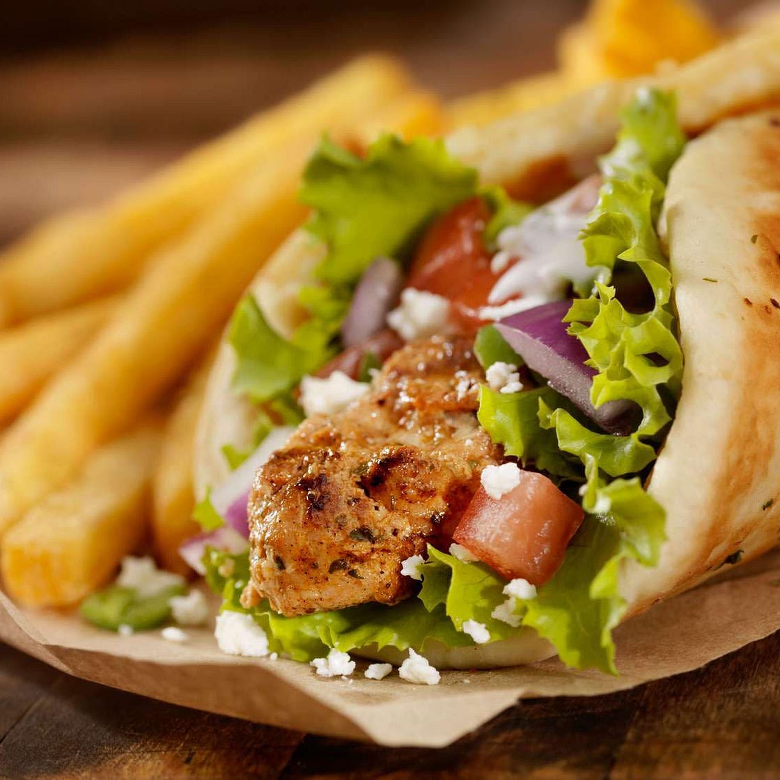 Moroccan Chicken on Pita with Lemon Herb Tahini Sauce + French Fries
