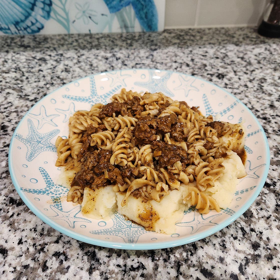 Vegan Beef and Noodles over Mashed Potatoes