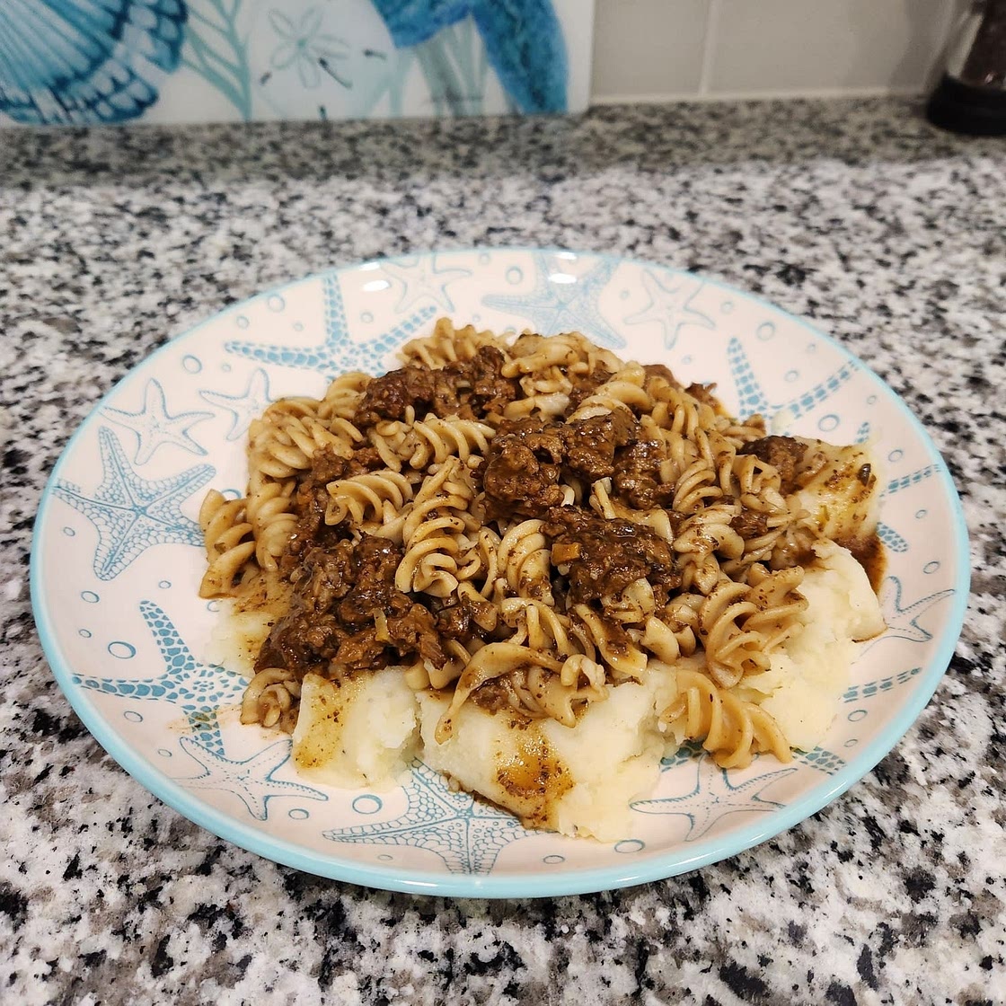 Vegan Beef and Noodles over Mashed Potatoes