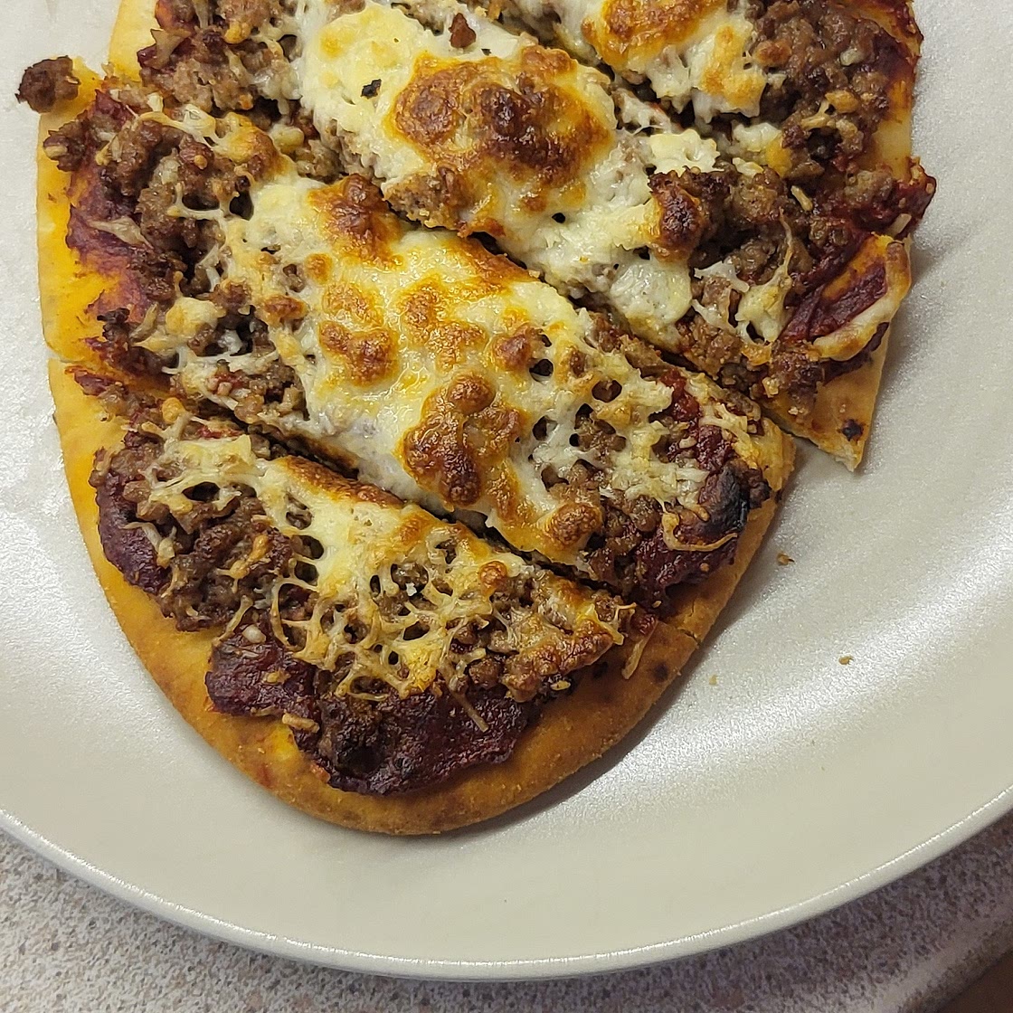 Sausage naanizza
