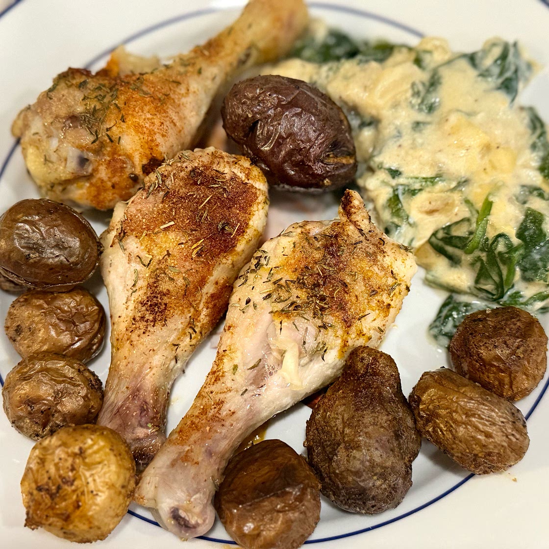 Roast chicken with squashed new potatoes & cheesy creamed spinach