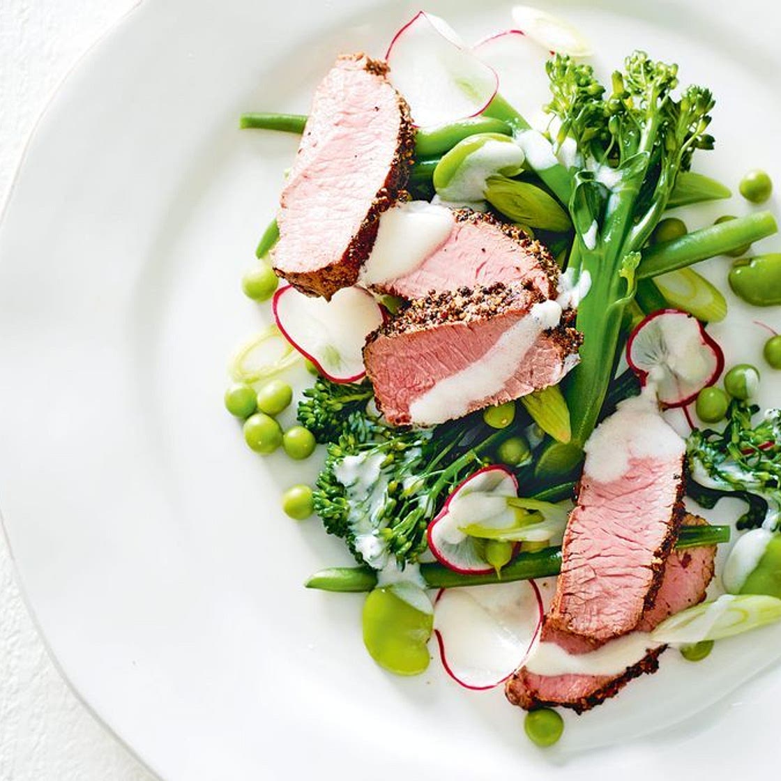 Spring vegetables with pepper-crusted lamb