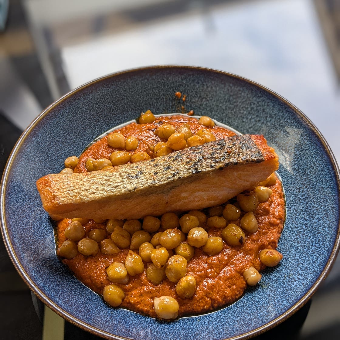 Crispy salmon, garlic and paprika chickpeas, roast pepper sauce