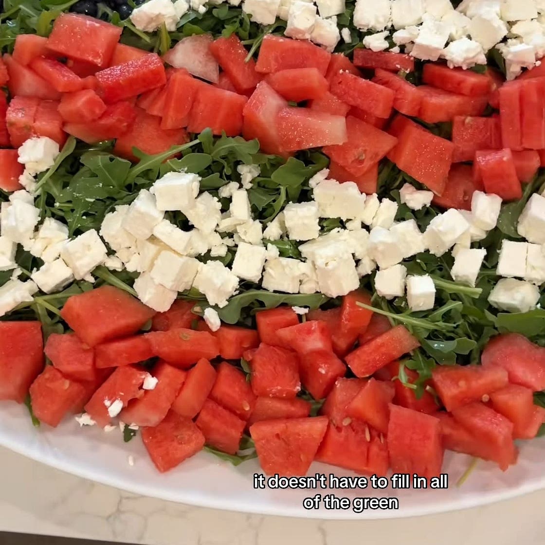 Kale, blueberry, strawberry, and feta salad