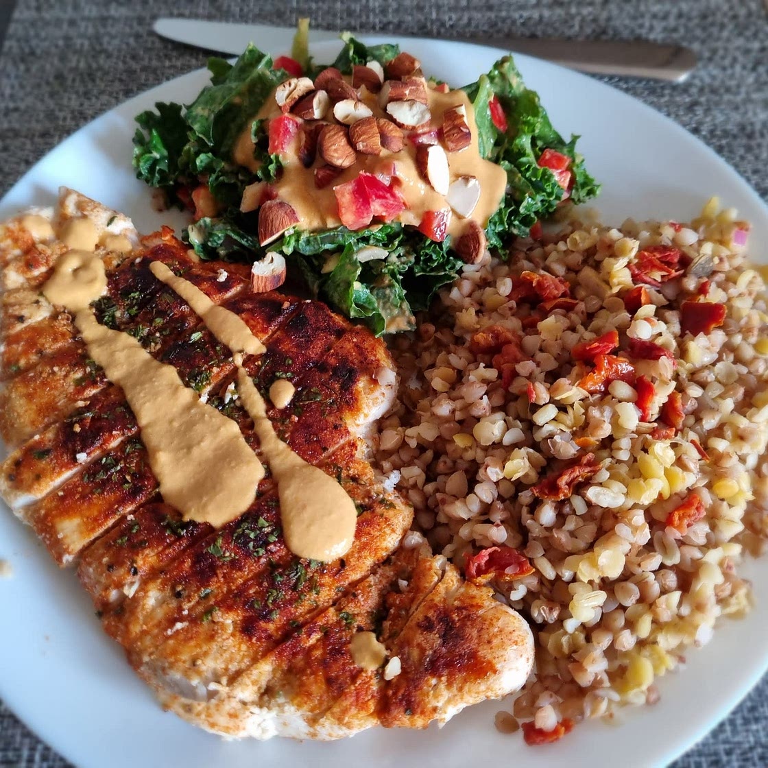 Cumin-crusted chicken with kale salad and hummus dressing