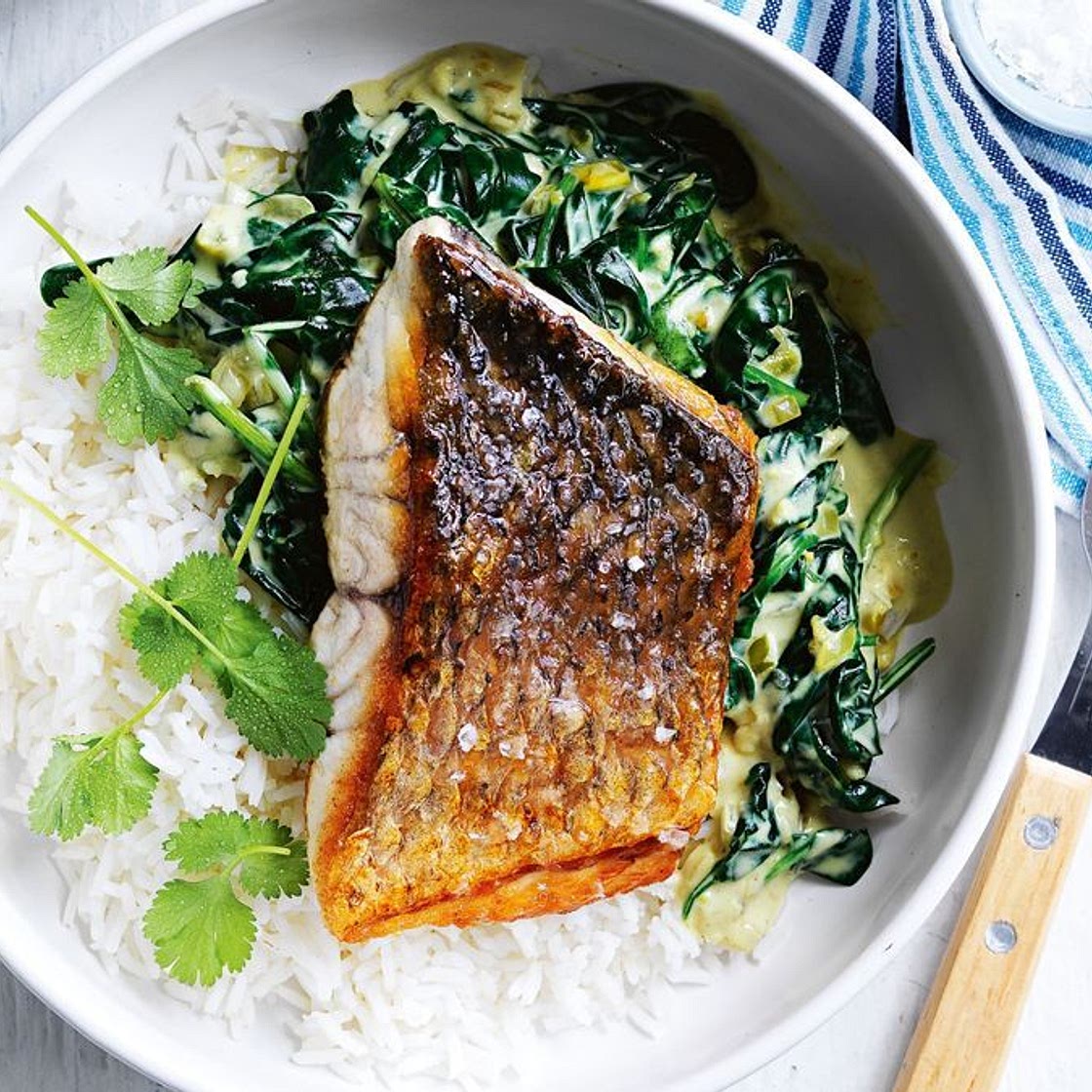 Barramundi with coconut creamed spinach and coriander
