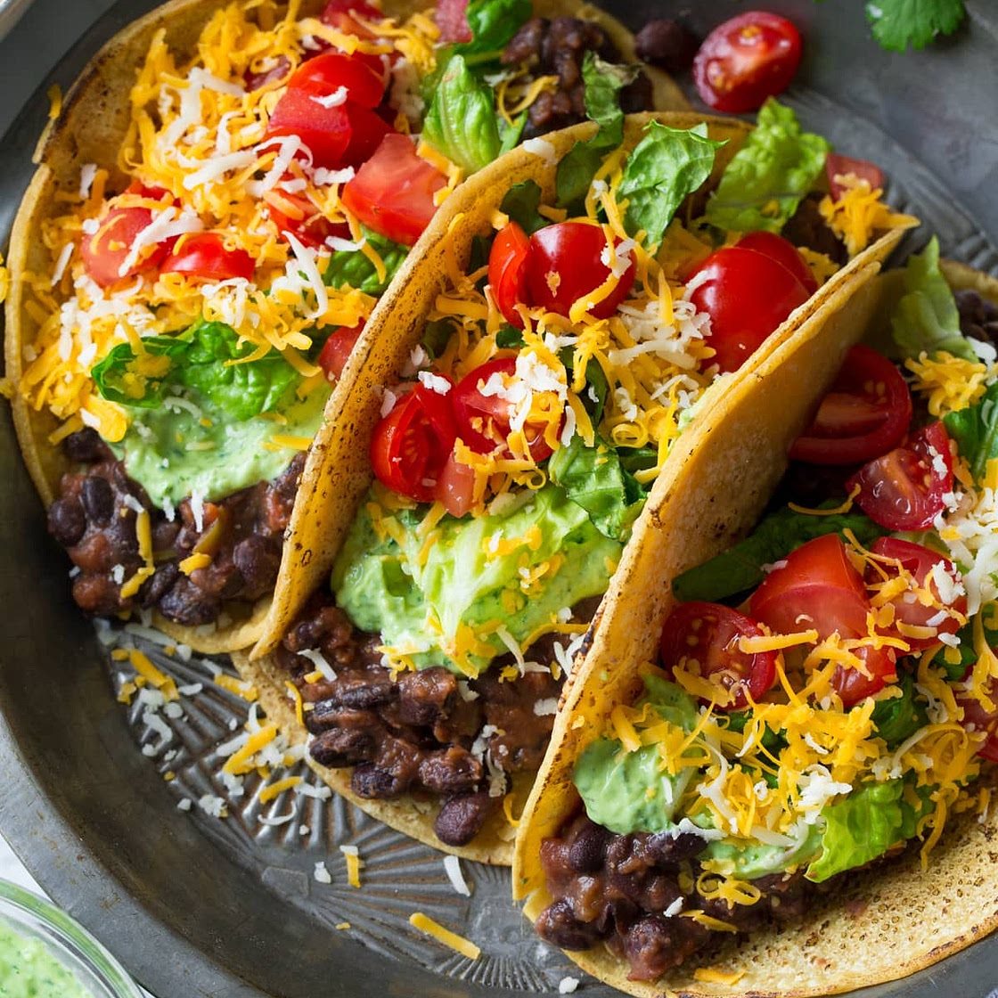 Black Bean Tacos {with Avocado Cilantro Lime Crema}