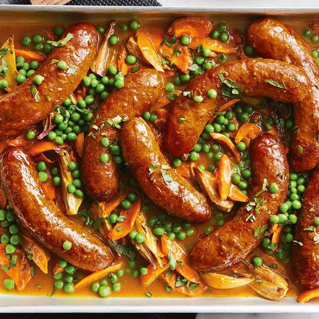 Super-easy curried sausage tray bake recipe