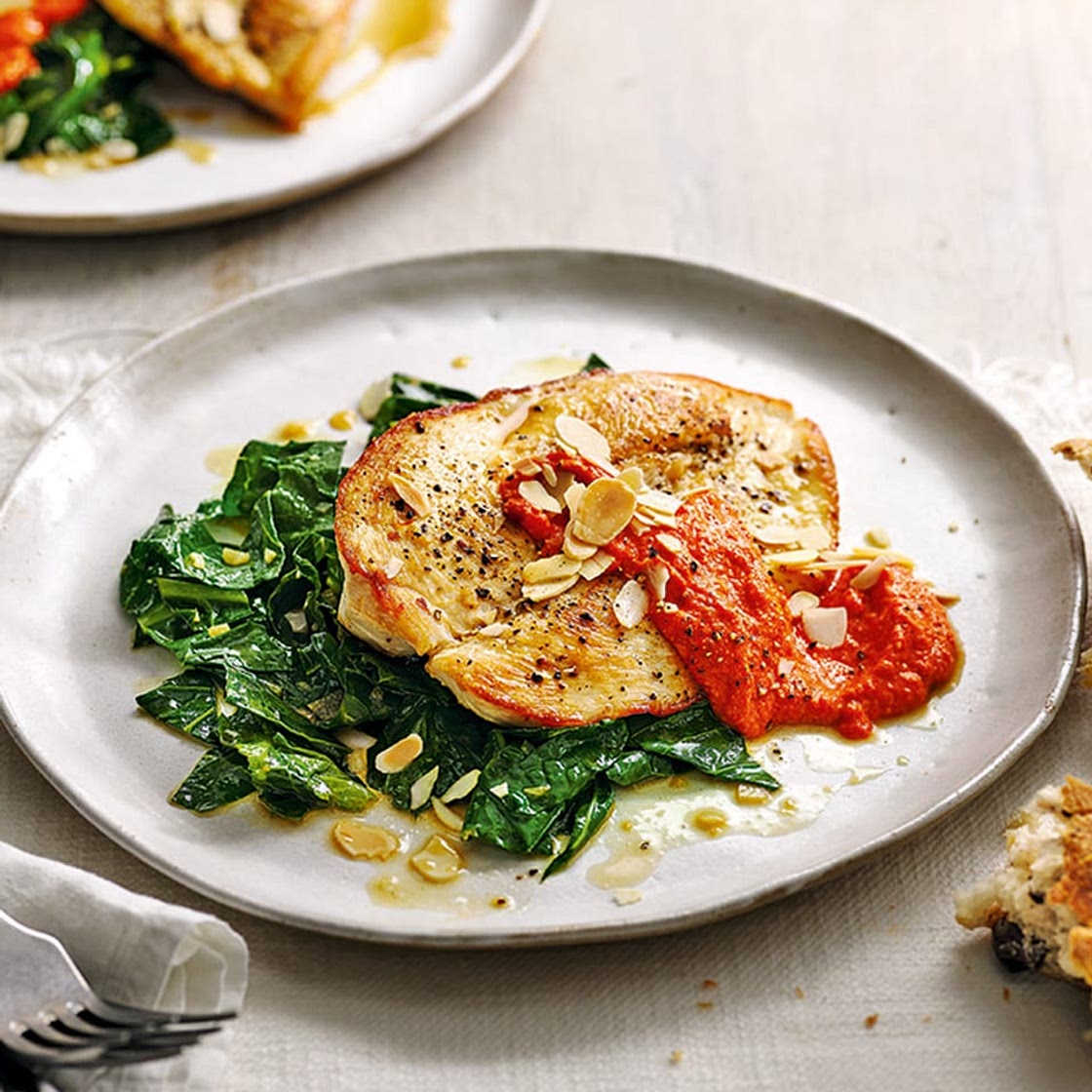 Chicken with smoky romesco sauce and garlicky greens