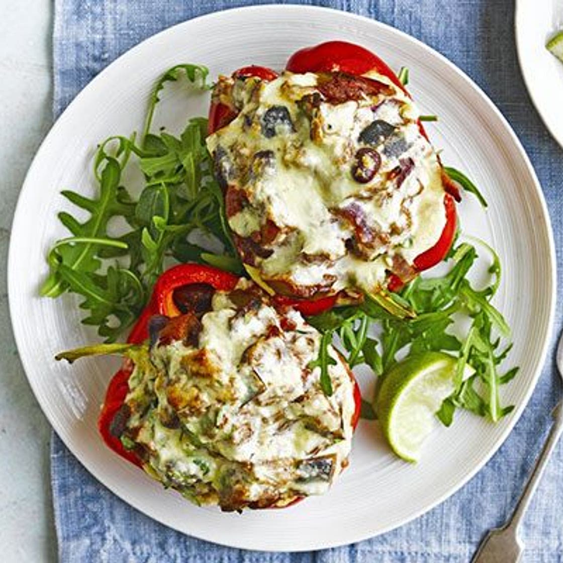 Vegetarian chilli-stuffed peppers with feta topping