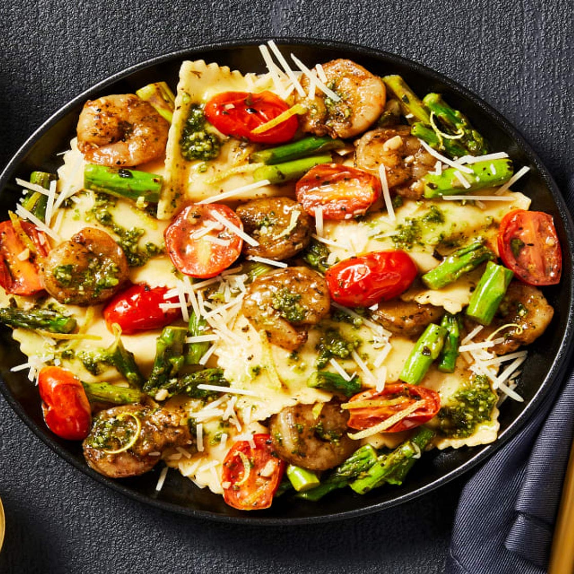 Pesto Shrimp & Lobster Filled Ravioli with Lemony Asparagus & Grape Tomatoes