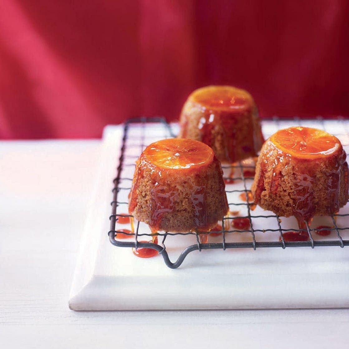 Sticky clementine steamed puddings