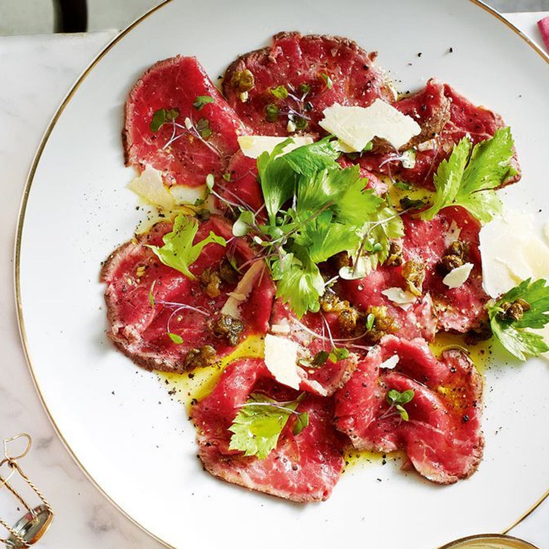 Beef carpaccio with crispy capers, pecorino and celery