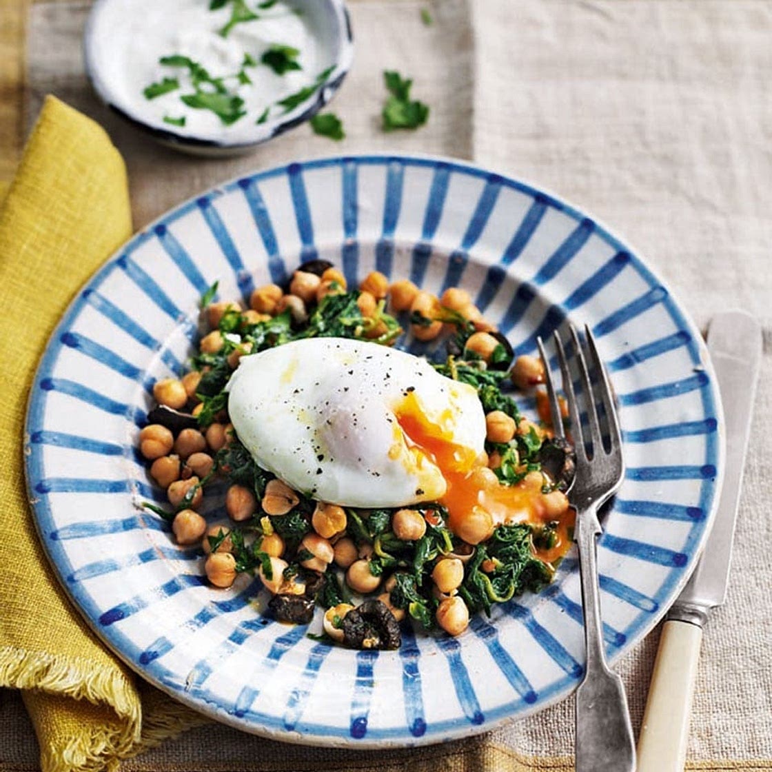 Poached eggs with harissa chickpeas and garlic yogurt