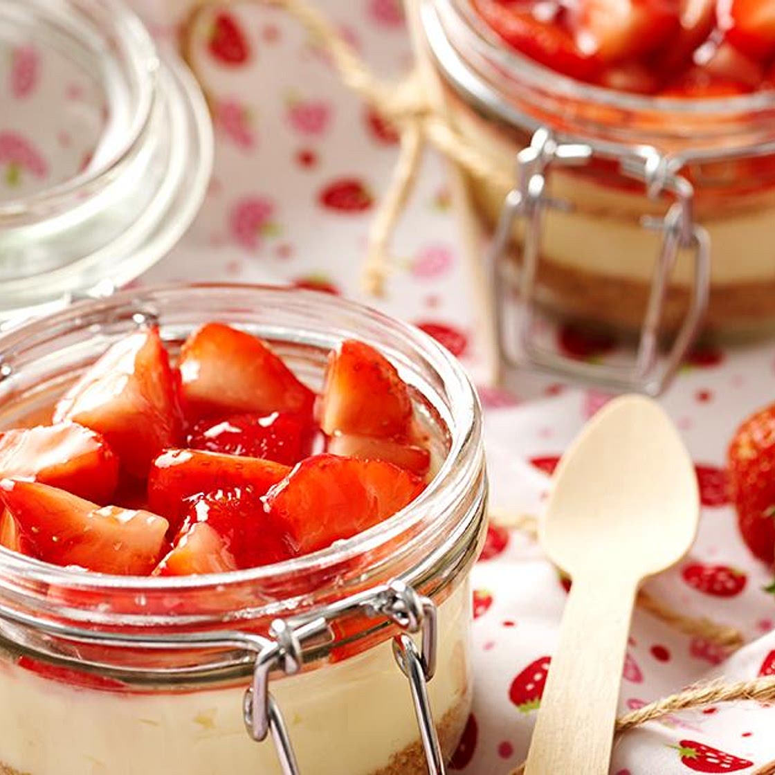 Individual strawberry and cream cheesecakes
