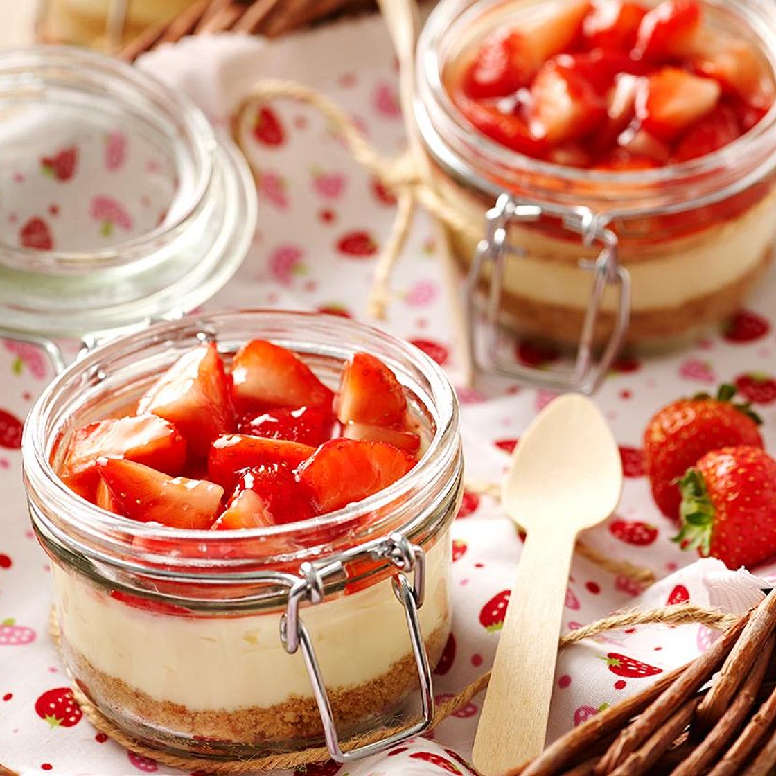 Individual strawberry and cream cheesecakes
