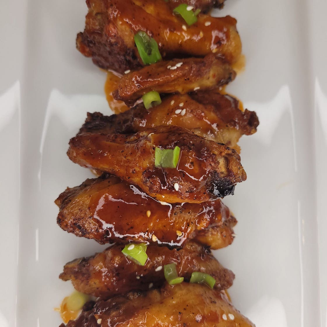 Air Fryer Chicken Wings Tossed In BBQ Rum Sauce