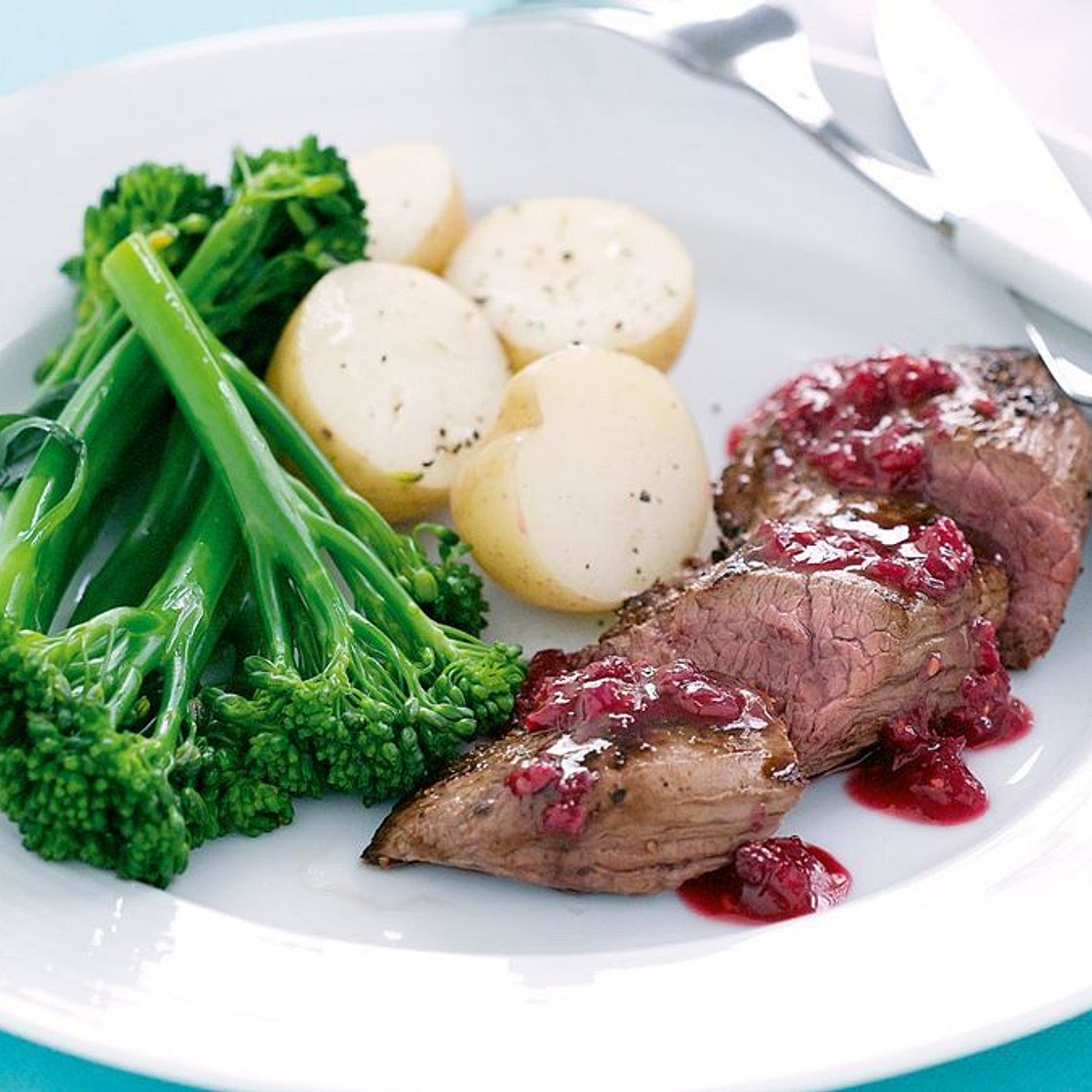 Seared kangaroo with raspberry glaze