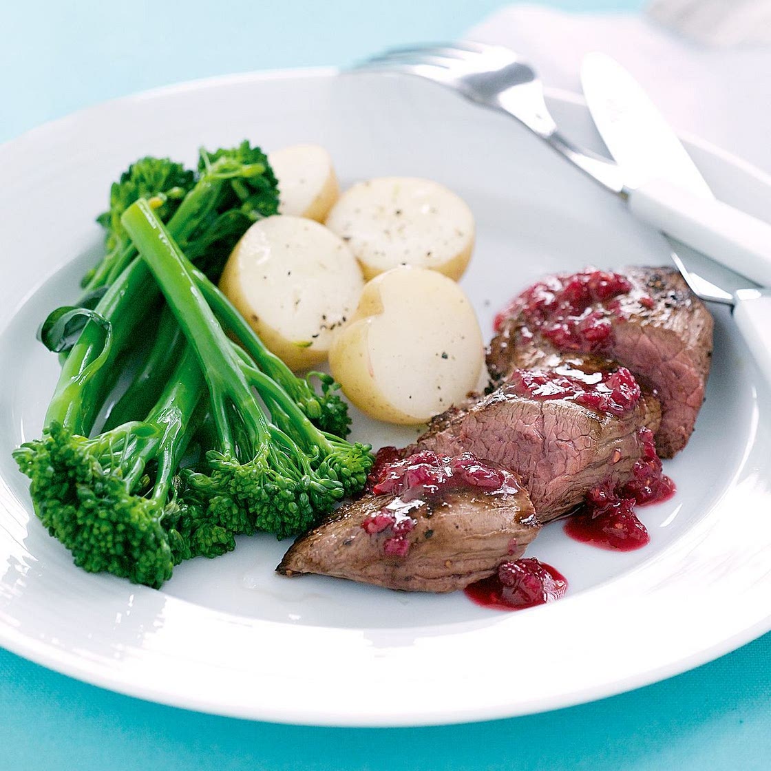 Seared kangaroo with raspberry glaze